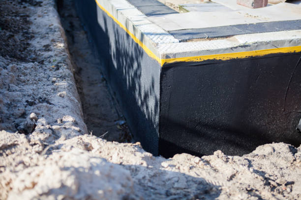 Professional Emergency Waterproofing technician working in Bellmore, NY
